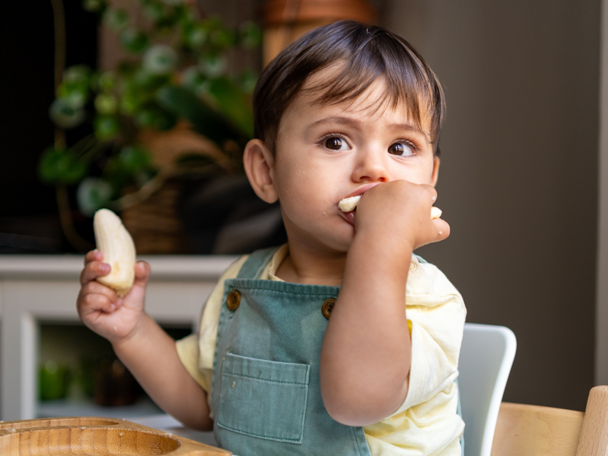 Boy eating a banana