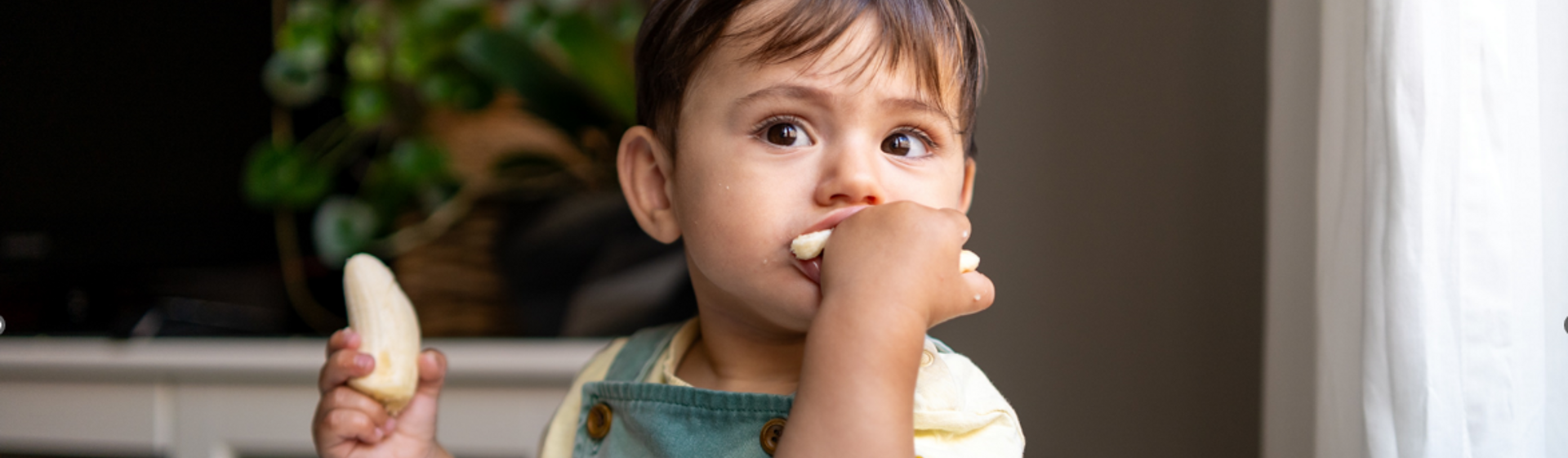 Boy eating a banana